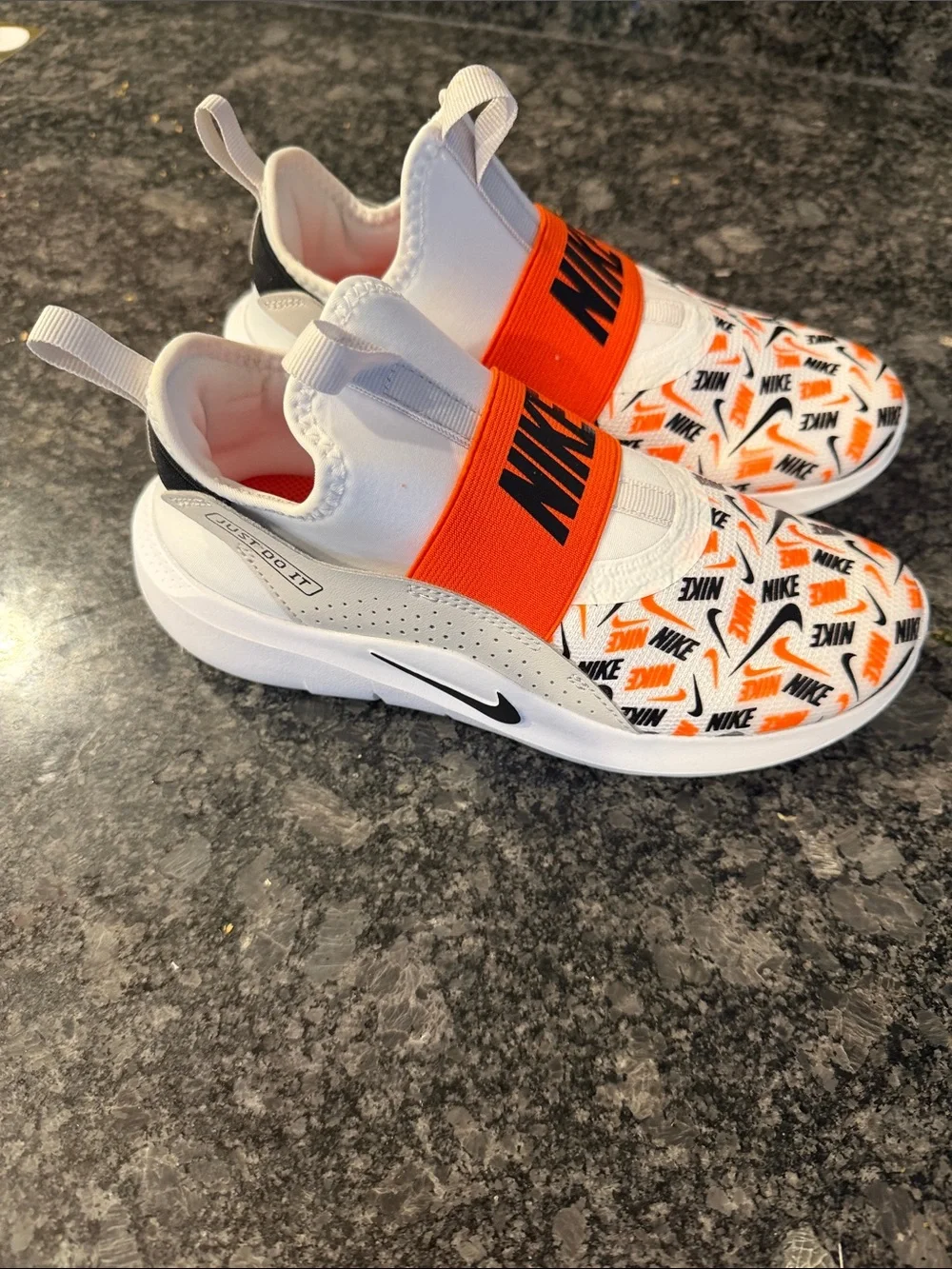 Nike White, Orange & Black Elastic-Strike Slip-Ons